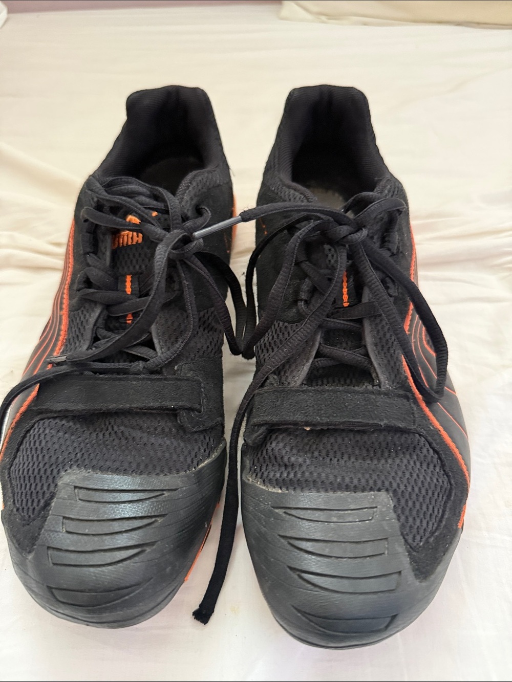 Puma Black Athletic Shoes with Orange Accents